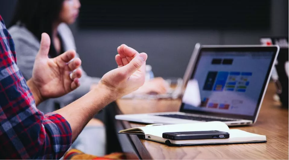 Email Marketing 4 Two Individuals Utilizing Email Marketing At A Table With Their Laptop.